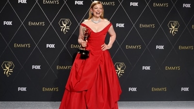 Sarah Snook poses with her Lead Actress in a Drama Series award, which she won for her role in Succesion at the 75th Primetime Emmy Awards in Los Angeles. The star channelled old Hollywood glamour in an off-shoulder red Vivienne Westwood gown and diamond-encrusted Cartier jewels.&nbsp; (Reuters)