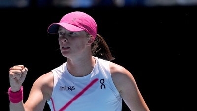 Iga Swiatek of Poland reacts after winning a point against Sofia Kenin of the U.S. during their first round match at the Australian Open (AP) Iga Swiatek of Poland reacts after winning a point against Sofia Kenin of the U.S. during their first round match at the Australian Open (AP)