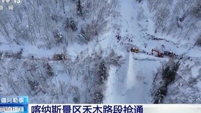 In this image taken from video footage run by China's CCTV, excavators clear a road blocked by snow in Altay Prefecture in northwestern China's Xinjiang Uyghur Autonomous Region. (AP) In this image taken from video footage run by China's CCTV, excavators clear a road blocked by snow in Altay Prefecture in northwestern China's Xinjiang Uyghur Autonomous Region. (AP)