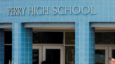 A medical examiner enters the school as police respond to a school shooting at the Perry Middle School and High School complex in Perry, Iowa, U.S., January 4, 2024 (REUTERS/Cheney Orr) (REUTERS)