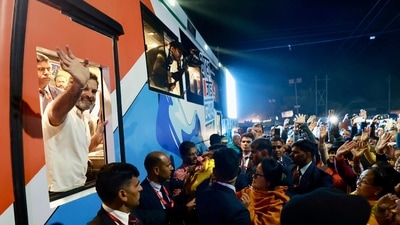 In this Handout photograph released by Indian Congress party office shows Congress party leader Rahul Gandhi waving to supporters from a bus during a two month-long cross-country march from the northeastern Indian state of Manipur in Thoubal district (AP)
