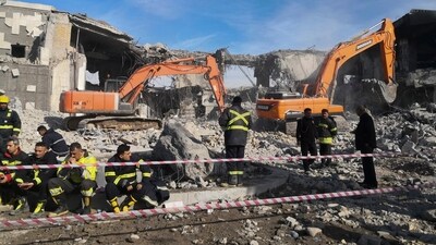 Emergency services clear the rubble of the house of Peshraw Dizayi that was hit in Iranian missile strikes in Irbil, Iraq. (AP)