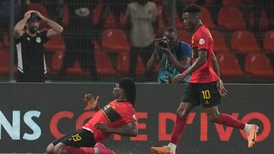 Angola's Mabululu, left, celebrates after scoring his side's first goal during the African Cup of Nations Group D soccer match between Algeria and Angola in Bouake (AP) Angola's Mabululu, left, celebrates after scoring his side's first goal during the African Cup of Nations Group D soccer match between Algeria and Angola in Bouake (AP)