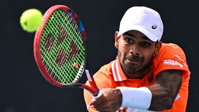 India's Sumit Nagal hits a return against Kazakhstan's Alexander Bublik during their men's singles match on day three of the Australian Open (AFP) India's Sumit Nagal hits a return against Kazakhstan's Alexander Bublik during their men's singles match on day three of the Australian Open (AFP)