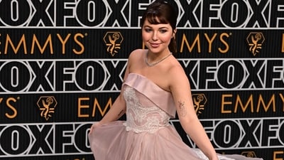 US actress Sammi Hanratty arrived at the 75th Emmy Awards in a stunning baby pink gown with an off-the-shoulder neckline, lace detailing at the top and a mesmerising, princess-inspired flared bottom. She completed her look with minimal make-up, a choker necklace and her hair tied up in a cute bun. (Frederic J. Brown / AFP)