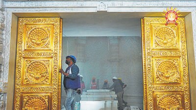 Workers install doors of the sanctum sanctorum on the Ram Temple on Tuesday. (PTI) Workers install doors of the sanctum sanctorum on the Ram Temple on Tuesday. (PTI)