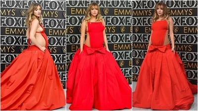 Pregnant Suki Waterhouse attended the Primetime Emmy Awards in a Valentino bright red gown. The ensemble is from the Italian luxury fashion house's Spring 2023 Couture collection. It has an open back detail, a column bodice, spaghetti shoulder straps and ribbons cinching the outfit, a bow embroidered on the front, and a voluminous skirt with pleated details. (AP) Pregnant Suki Waterhouse attended the Primetime Emmy Awards in a Valentino bright red gown. The ensemble is from the Italian luxury fashion house's Spring 2023 Couture collection. It has an open back detail, a column bodice, spaghetti shoulder straps and ribbons cinching the outfit, a bow embroidered on the front, and a voluminous skirt with pleated details. (AP)