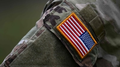 A soldier of the US army wears the country's flag on his uniform. (AFP)