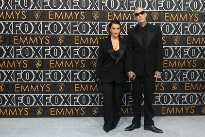 Kourtney Kardashian and Travis Barker attend the 75th Primetime Emmy Awards in stunning all-black outfits. (REUTERS)