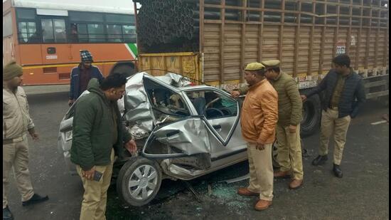 Police inspect one of the vehicles damaged in the pileup on Tuesday morning. (HT Photot)