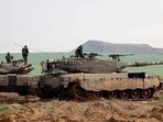 Israel-Hamas War: Israeli battle tanks take a position along the border with the Gaza Strip in southern Israel. Israel-Hamas War: Israeli battle tanks take a position along the border with the Gaza Strip in southern Israel.