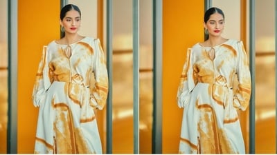 Assisted by fashion stylist Abhilasha Devnani, Sonam accessorised her look with a pair of quirky golden hoop statement earrings and a pair of brown kitten pump heels. (Instagram/@sonamkapoor) Assisted by fashion stylist Abhilasha Devnani, Sonam accessorised her look with a pair of quirky golden hoop statement earrings and a pair of brown kitten pump heels. (Instagram/@sonamkapoor)