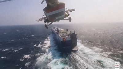 This photo released by the Houthi Media Center shows a Houthi forces helicopter approaching the cargo ship Galaxy Leader on Sunday, Nov. 19, 2023. Yemen's Houthis have seized the ship in the Red Sea off the coast of Yemen after threatening to seize all vessels owned by Israeli companies. AP/PTI(AP11_21_2023_000102A) (AP) This photo released by the Houthi Media Center shows a Houthi forces helicopter approaching the cargo ship Galaxy Leader on Sunday, Nov. 19, 2023. Yemen's Houthis have seized the ship in the Red Sea off the coast of Yemen after threatening to seize all vessels owned by Israeli companies. AP/PTI(AP11_21_2023_000102A) (AP)
