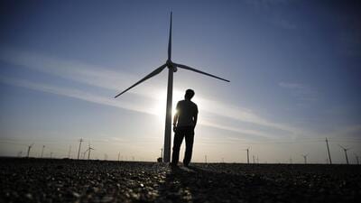 For Representation Only: A worker stands as he looks at a wind turbine used to generate electricity. (Reuters File Photo)