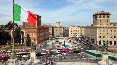 The Italian national flag flies near a monument to the unknown soldier overlooking a construction site for an underground station in Piazza Venezia in downtown Rome, Italy, on Monday, Oct. 30, 2023. Italy's economy stagnated in the third quarter � just dodging a recession as Prime Minister Giorgia Meloni battles to keep output expanding while also limiting debt. Photographer: Alessia Pierdomenico/Bloomberg (Bloomberg)