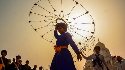 In some places, the 'Nagar Prabhat Pheri' was also organized. In this photo. a Sikh youth can be seen performing during a 'Nagar Kirtan' procession organised on the eve of the birth anniversary of Guru Gobind Singh at the Golden Temple in Amritsar. (PTI) In some places, the 'Nagar Prabhat Pheri' was also organized. In this photo. a Sikh youth can be seen performing during a 'Nagar Kirtan' procession organised on the eve of the birth anniversary of Guru Gobind Singh at the Golden Temple in Amritsar. (PTI)