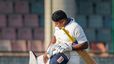 Mumbai player Sarfaraz Khan celebrates his century on the first day of the Ranji Trophy cricket match against Delhi (PTI) Mumbai player Sarfaraz Khan celebrates his century on the first day of the Ranji Trophy cricket match against Delhi (PTI)