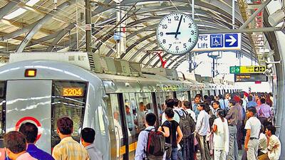 Passengers board a train at a metro station in Delhi. (HT Photo) Passengers board a train at a metro station in Delhi. (HT Photo)