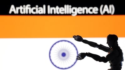 AI Artificial intelligence words, miniature of robot and an Indian flag are seen in this illustration taken December 21, 2023. REUTERS/Dado Ruvic/Illustration (REUTERS)
