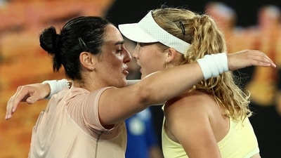 Russia's Mirra Andreeva (R) hugs Tunisia's Ons Jabeur after their women's singles match (AFP) Russia's Mirra Andreeva (R) hugs Tunisia's Ons Jabeur after their women's singles match (AFP)