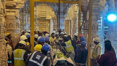 Workers bring the idol of Ram Lalla at the sanctum sanctorum of the Ram Temple in Ayodhya on Wednesday. (PTI) Workers bring the idol of Ram Lalla at the sanctum sanctorum of the Ram Temple in Ayodhya on Wednesday. (PTI)