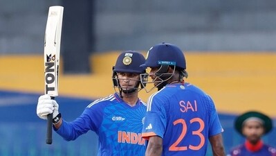 (FILE) Abhishek Sharma raises his bat after scoring a half-century
