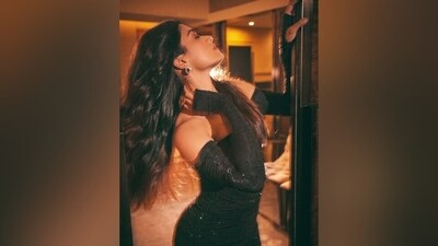 The black gown is from the shelves of designer Alex Perry's eponymous label. She styled it with matching finger-less Opera gloves decked in shimmering black beads. Statement gem-adorned earrings and pointed stilettos adorned in sequin embellishments gave the finishing touch to her all-black look. (Instagram) The black gown is from the shelves of designer Alex Perry's eponymous label. She styled it with matching finger-less Opera gloves decked in shimmering black beads. Statement gem-adorned earrings and pointed stilettos adorned in sequin embellishments gave the finishing touch to her all-black look. (Instagram)