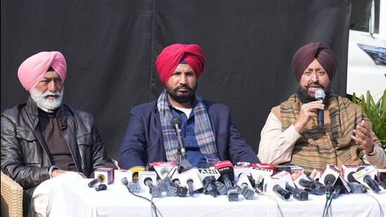 Congress MLA Sukhpal Singh Khaira along with PPCC chief Amarinder Singh Raja Warring and LoP Partap Singh Bajwa in Chandigarh on Wednesday. (HT)