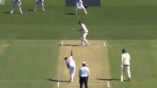 Shamar Joseph bowls his first ball to Steve Smith