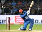 Afghanistan's Gulbadin Naib plays a shot during the 3rd T20I against India, at M.Chinnaswamy Stadium in Bengaluru