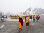 Devotees arrive at Lata Mangeshkar Chowk on a cold winter morning ahead of the consecration ceremony of Shri Ram Janmabhoomi Temple, in Ayodhya, Devotees arrive at Lata Mangeshkar Chowk on a cold winter morning ahead of the consecration ceremony of Shri Ram Janmabhoomi Temple, in Ayodhya,