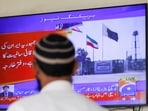 A man looks at a television screen after the Pakistani foreign ministry said the country conducted strikes inside Iran on January 18.