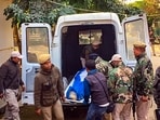 Security personnel carry mortal remains of policeman Wangkhem Somorjit, who sustained gunshot wounds in a militant attack and succumbed to injuries during treatment, in Manipur