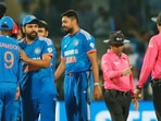 Rohit Sharma shaking hands with teammates as umpires congratulate each other after IND vs AFG 3rd T20I