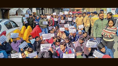 Job aspirants stage a protest demanding declaration of results, outside the Himachal secretariat in Shimla on Thursday. (ANI)