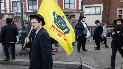 Hasidic men and boys gather outside of the Chabad-Lubavitch global headquarters in Crown Heights, Brooklyn where a secret tunnel was recently discovered on January 12, 2024 in New York City. (Getty Images via AFP) Hasidic men and boys gather outside of the Chabad-Lubavitch global headquarters in Crown Heights, Brooklyn where a secret tunnel was recently discovered on January 12, 2024 in New York City. (Getty Images via AFP)