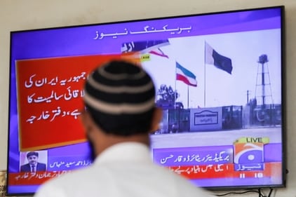 A man looks at a television screen after the Pakistani foreign ministry said the country conducted strikes inside Iran targeting separatist militants, two days after Tehran said it attacked Israel-linked militant bases inside Pakistani territory, in Karachi, Pakistan January 18. (Reuters.)