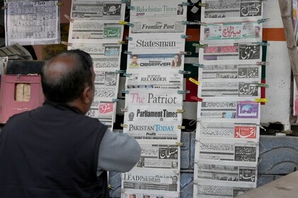 A Pakistani checks morning newspapers covering front page story of Iran's strike, at a stall in Islamabad, Pakistan on January 18. (AP) A Pakistani checks morning newspapers covering front page story of Iran's strike, at a stall in Islamabad, Pakistan on January 18. (AP)