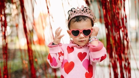 The birthday girl wore a pink peplum top adorned with red hearts, along with heart-shaped sunglasses, red pants and a tiara on her head. Priyanka Chopra and Nick Jonas had announced Malti Marie Chopra Jonas' birth back in January 2022 -- and four months later in May of that year, the pair revealed Malti had spent 100 days in the NICU and was home in time for Mother's Day 2022.