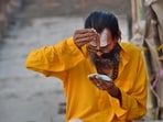 A devotee on the banks of the Saryu river in Ayodhya. (HT Photo) A devotee on the banks of the Saryu river in Ayodhya. (HT Photo)