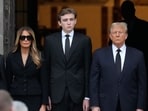 Former President Donald Trump, center right, stands with his wife Melania, second left, their son Barron, center left, and father-in-law Viktor Knavs, as the coffin carrying the remains of Amalija Knavs, the former first lady's mother, is carried into the Church of Bethesda-by-the-Sea for her funeral, Thursday, Jan. 18, 2024, in Palm Beach, Fla. (AP Photo/Rebecca Blackwell) Former President Donald Trump, center right, stands with his wife Melania, second left, their son Barron, center left, and father-in-law Viktor Knavs, as the coffin carrying the remains of Amalija Knavs, the former first lady's mother, is carried into the Church of Bethesda-by-the-Sea for her funeral, Thursday, Jan. 18, 2024, in Palm Beach, Fla. (AP Photo/Rebecca Blackwell)