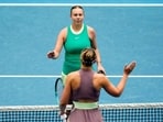 Amanda Anisimova, top, of the U.S. is congratulated by Paula Badosa of Spain following their third round match at the Australian Open tennis championships at Melbourne Park, Melbourne, Australia