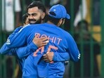 India's Virat Kohli celebrates with his captain Rohit Sharma