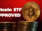 Representation of Bitcoin cryptocurrency and "Bitcoin ETF Approved" words are seen in this illustration taken January 11, 2024. REUTERS/Dado Ruvic/Illustration