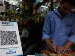  A QR code of Paytm is seen at a mobile repairing shop in Kolkata. (Reuters)