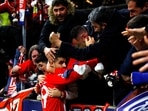 Atletico Madrid's Alvaro Morata celebrates scoring their second goal with fans 