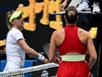 Ukraine's Lesia Tsurenko shakes hands with the umpire after losing her third round match as Belarus' Aryna Sabalenka looks on 