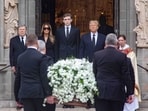Viktor Knavs, Melania Trump, Barron Trump, former U.S. President Donald Trump and Rev. Tim Schenck watch as the the casket of Melania's mother Amalija Knavs is brought into the church for her funeral at The Church of Bethesda-by-the-Sea in Palm Beach, Florida, U.S. January 18, 2024. 