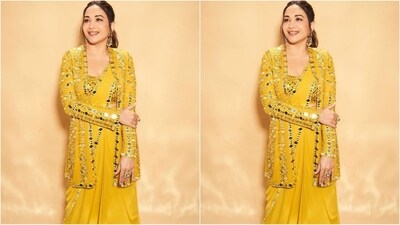 Assisted by celebrity fashion stylist Mohit Rai, Madhuri styled her look with a pair of gold statement earrings, an oversized quirky gold ring adorning her finger and a pair of high heels that perfectly complemented her mesmerising look. (Instagram/@madhuridixitnene) Assisted by celebrity fashion stylist Mohit Rai, Madhuri styled her look with a pair of gold statement earrings, an oversized quirky gold ring adorning her finger and a pair of high heels that perfectly complemented her mesmerising look. (Instagram/@madhuridixitnene)