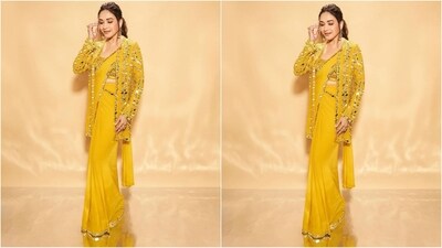 Madhuri's yellow saree is from the designer Seema Gujral and features a luxurious georgette fabric adorned with mirror work embellished sleek border all over. She paired it with an embroidered blouse and a front open jacket embellished with mirror work. Her saree comes with a whooping price tag of <span class='webrupee'>₹</span>1.38 lakh (Instagram/@madhuridixitnene) Madhuri's yellow saree is from the designer Seema Gujral and features a luxurious georgette fabric adorned with mirror work embellished sleek border all over. She paired it with an embroidered blouse and a front open jacket embellished with mirror work. Her saree comes with a whooping price tag of <span class='webrupee'>₹</span>1.38 lakh (Instagram/@madhuridixitnene)